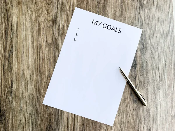 Clipboard with my goals on wood desk. — Stock Photo, Image