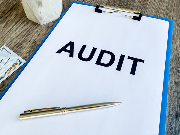 Clipboard with text plan on wood desk.