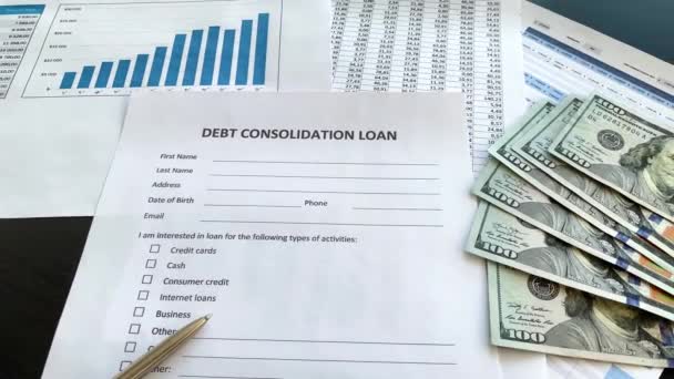 Debt consolidation loan document with graph on table. — Stock Video