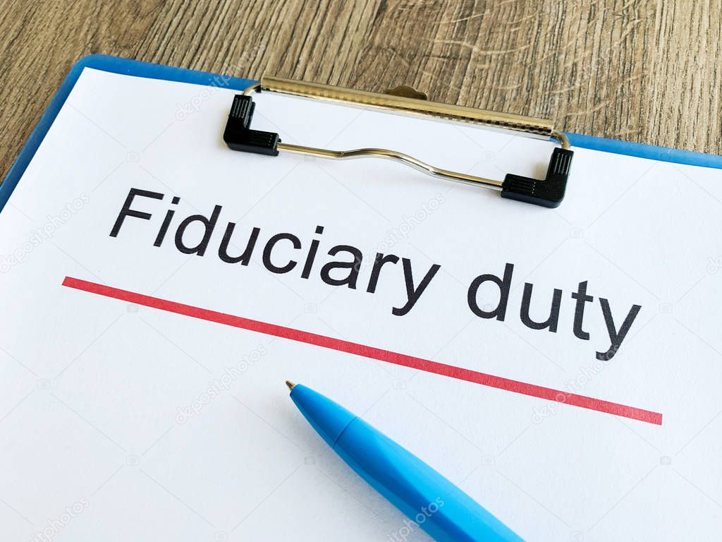 Paper with text fiduciary duty on wood table