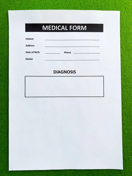 Medical form with patient data on doctors desk — Stock Photo, Image