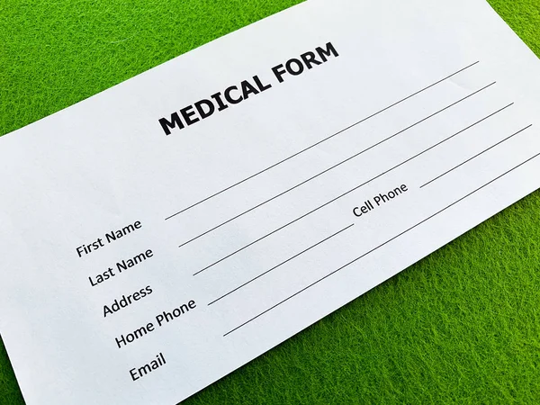 Medical form with patient data on doctors desk