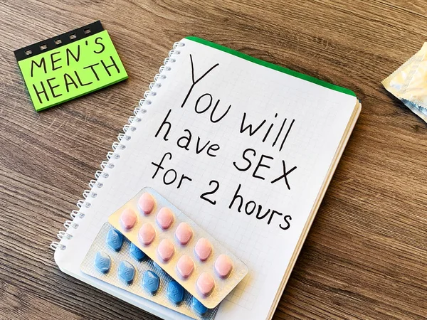 Pills for mens sexual health and notepad with text. — Stock Photo, Image