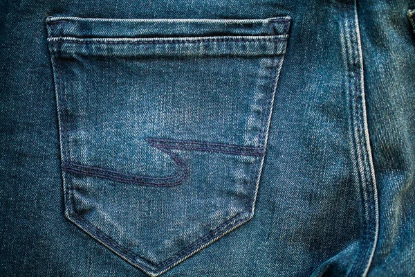Джинсові блакитні джинси укладають текстуру фону крупним планом — стокове фото