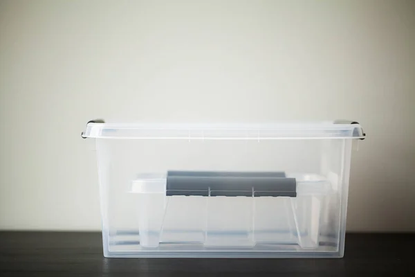 Transparent drawers for storing things on a wooden table