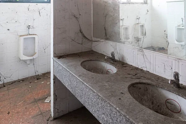 Abandoned toilet. a lot of cobwebs and garbage in abandoned toilet. — Stock Photo, Image