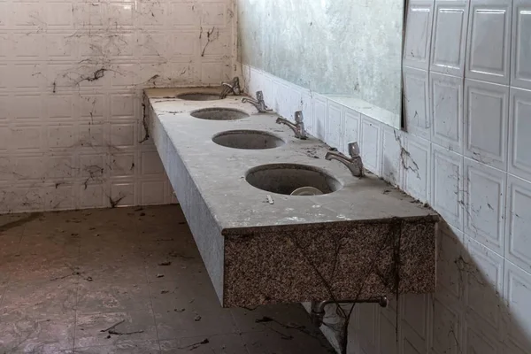 Abandoned toilet. a lot of cobwebs and garbage in abandoned toilet. — Stock Photo, Image