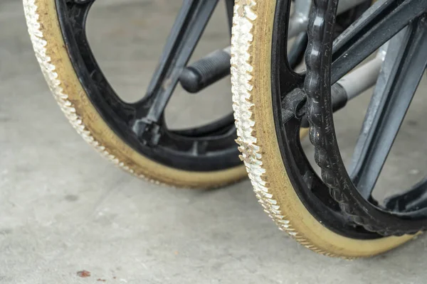 Degenerate flat-free tires of old wheelchair. Wheelchair tyres
