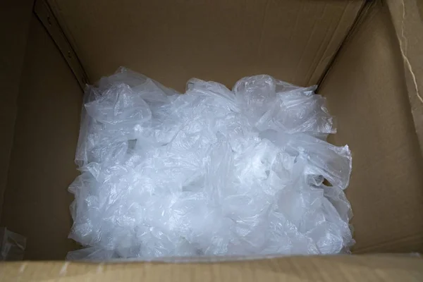 used plastic bag in paper box for recycling.