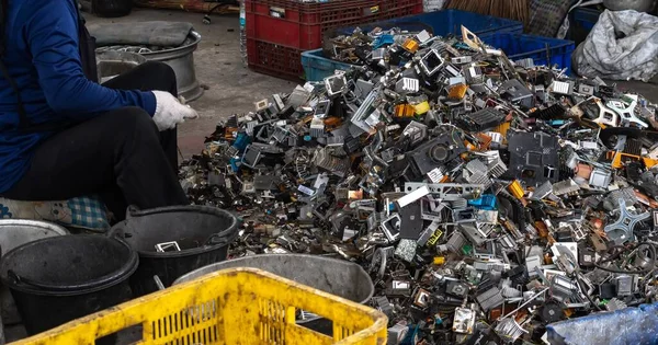 Scrap yard electronic waste for recycling with selective focus. electronic aluminium waste