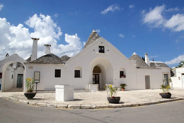 Trullo Sovrano at Alberobello, Apulia, Italy. Trullo Sovrano is built on two levels with internal staircase. Alberobello is a small town in southern Italy. A trullo is a traditional Apulian dry stone hut with a conical roof.