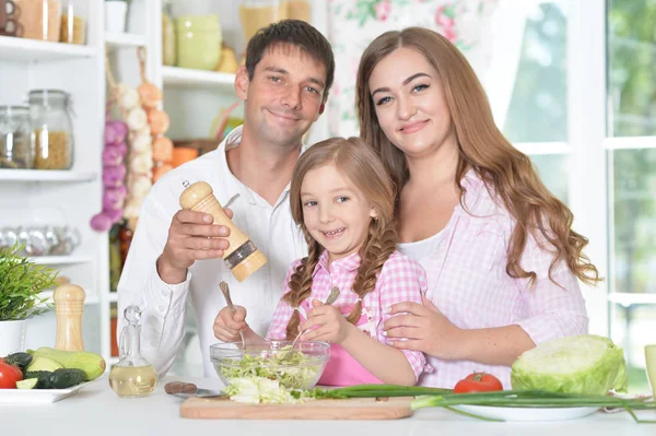 Cute little daughter preparing salad — Stock Photo, Image