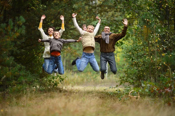 Family of four in park — Stock Photo, Image