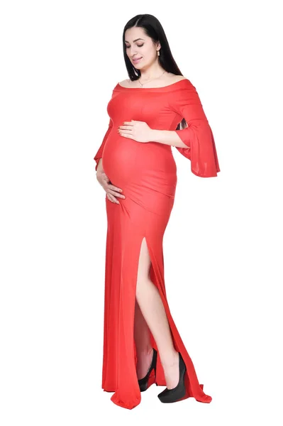 Mujer Embarazada Vestido Rojo Posando Aislada Sobre Fondo Blanco —  Fotos de Stock