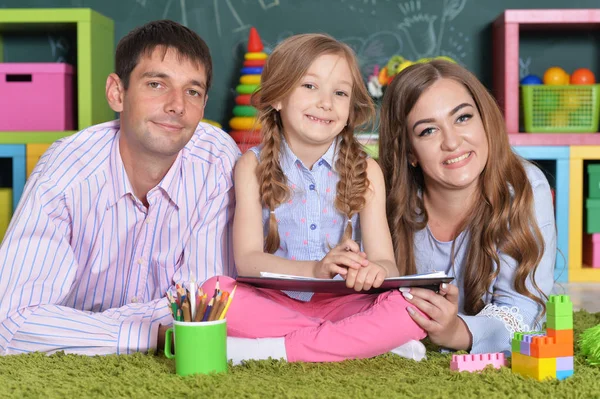 Little girl with plaits drawing — Stock Photo, Image