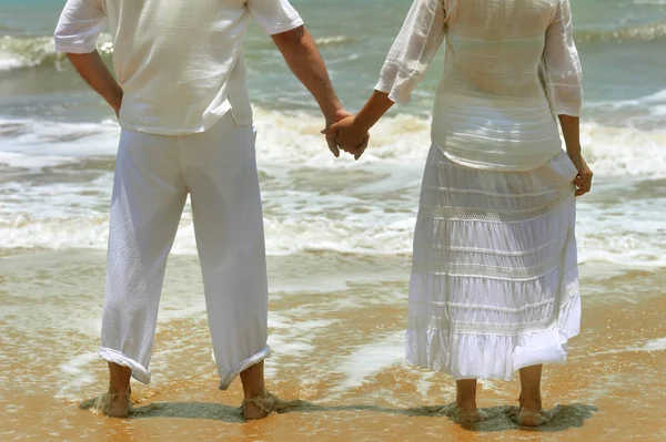 Couple holding hands together — Stock Photo, Image