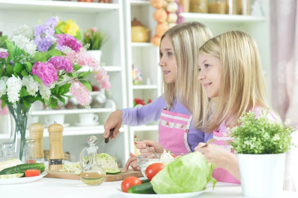 Two Girls Pink Aprons Preparing Fresh Salad Kitchen Table — Stock Photo, Image