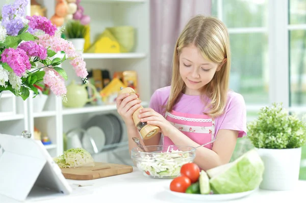 Cute Little Girl Spicing Fresh Salad Kitchen Table — Stock Photo, Image