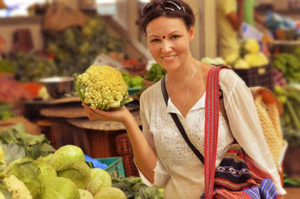 Woman choosing vegetables on market — Stock Photo, Image