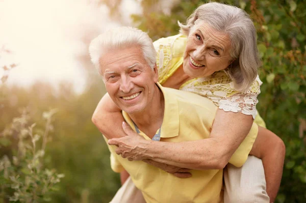 Mature couple   in summer park — Stock Photo, Image