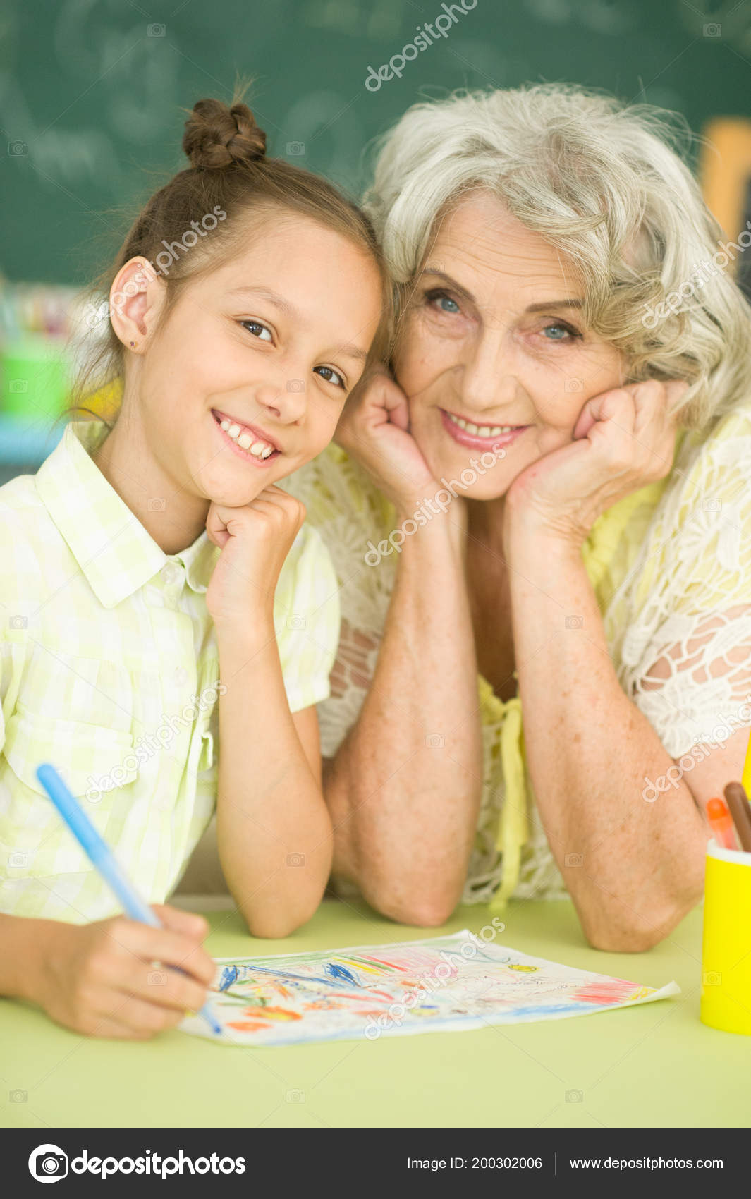 Portrait Grandmother Granddaughter Drawing Together Stock Photo