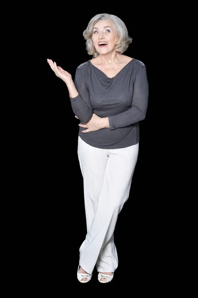 Senior Woman Showing Something Isolated Back Background — Stock Photo, Image