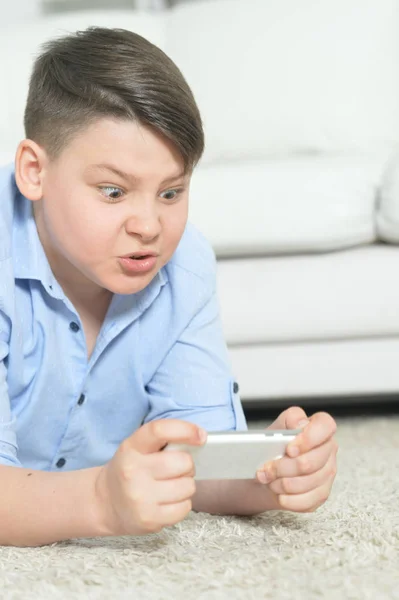 Exited Boy Smartphone Playing Game Home — Stock Photo, Image