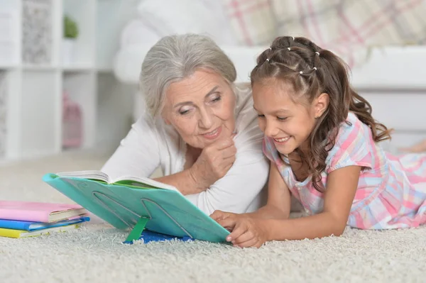 Grandmother Cute Little Girl Doing Homework Together While Lying Floor — Stock Photo, Image