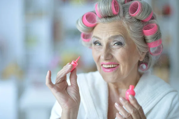 Senior woman in bathrobe — Stock Photo, Image