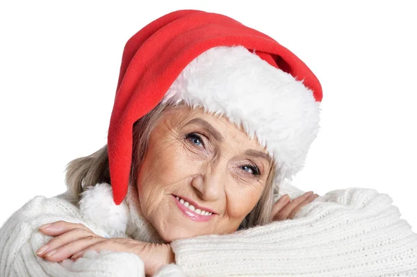 サンタの帽子は白い背景で隔離の年配の女性の肖像画 — ストック写真