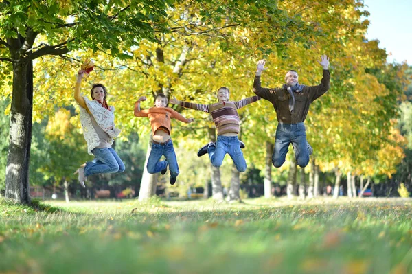 Family Four Jumping Autumn Park — Stock Photo, Image