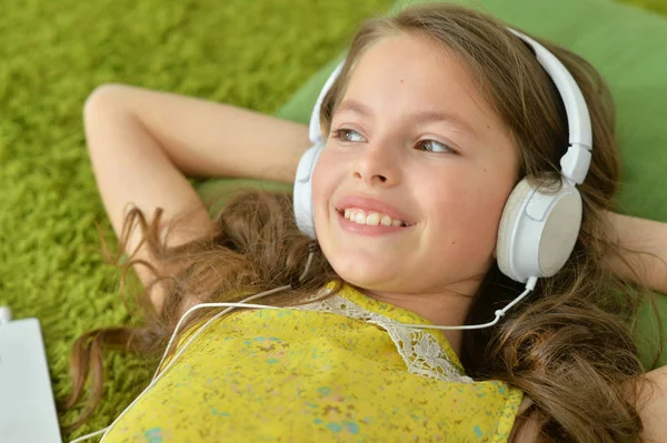 Cute little girl with headphones — Stock Photo, Image