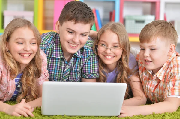 Children looking at modern laptop — Stock Photo, Image