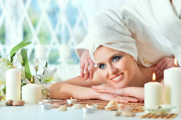 Beautiful Young Woman Relaxing Massage Spa Salon Stock Image