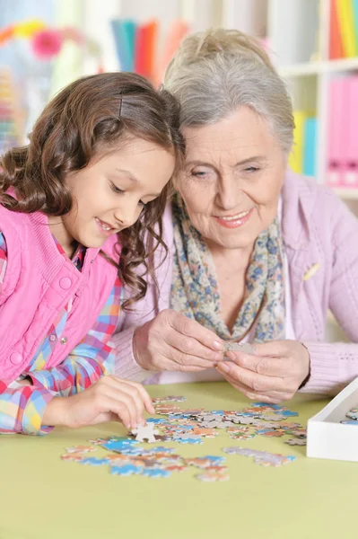 Grandmother Little Granddaughter Collecting Puzzle — Stock Photo, Image