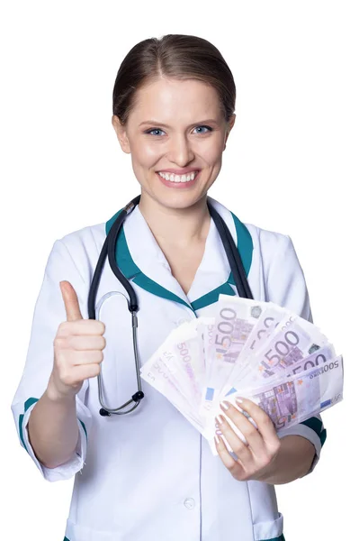 Médico segurando contas de dinheiro — Fotografia de Stock