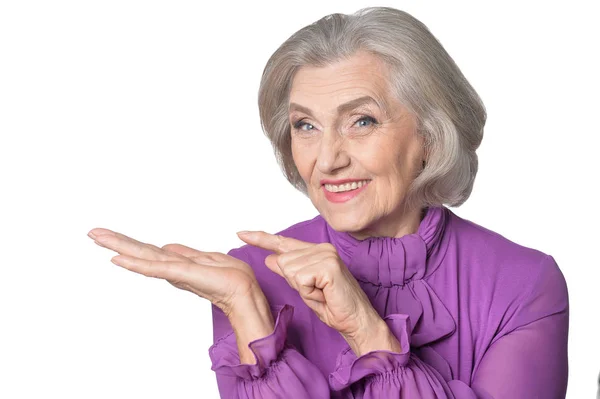 Senior woman pointing — Stock Photo, Image