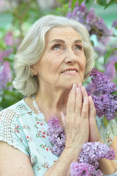 Happy Senior Beautiful Woman Lilacs Background Spring Park Praying — Stock Photo, Image