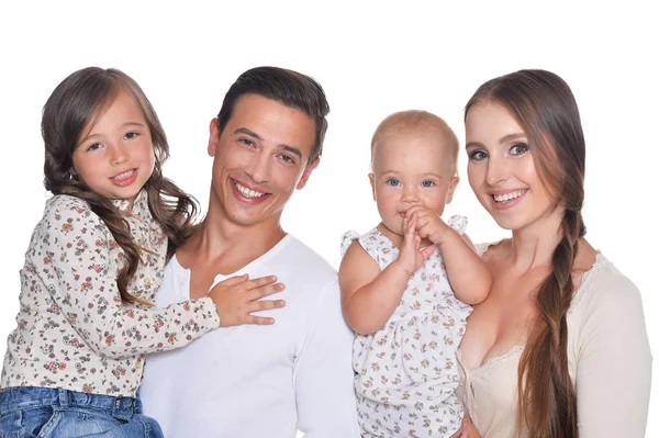 Lycklig familj av fyra på vit — Stockfoto