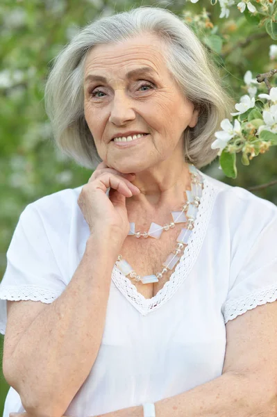 Happy Senior Beautiful Woman Spring Park Blooming Apple Tree Background — Stock Photo, Image