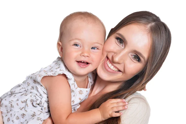 Frau mit kleiner Tochter auf einem weißen — Stockfoto