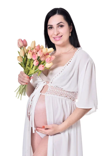 孕妇摆姿势与鲜花隔离在白色背景 — 图库照片
