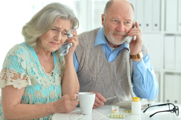 Sick Senior Couple Calling Doctor Home — Stock Photo, Image