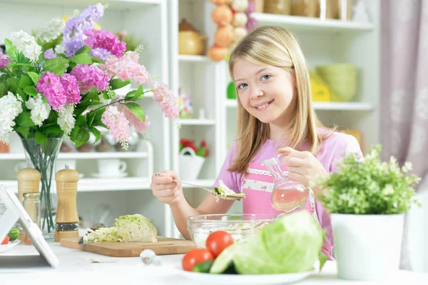 Cute Little Girl Preparing Fresh Salad Kitchen Table Tablet Home — Stock Photo, Image