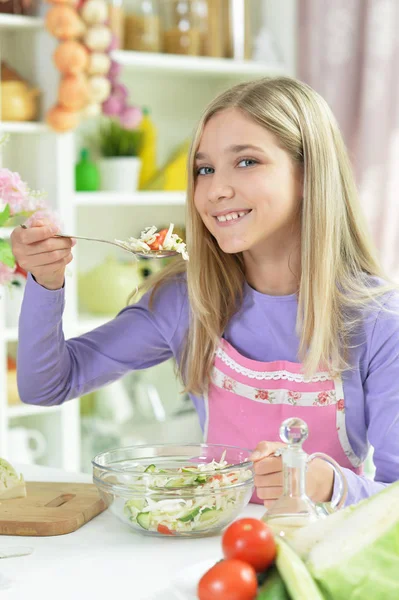 Cute Little Girl Spicing Fresh Salad Kitchen Table — Stock Photo, Image