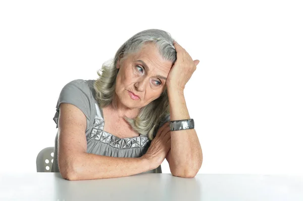 Triste Donna Anziana Tavola Isolata Sfondo Bianco — Foto Stock