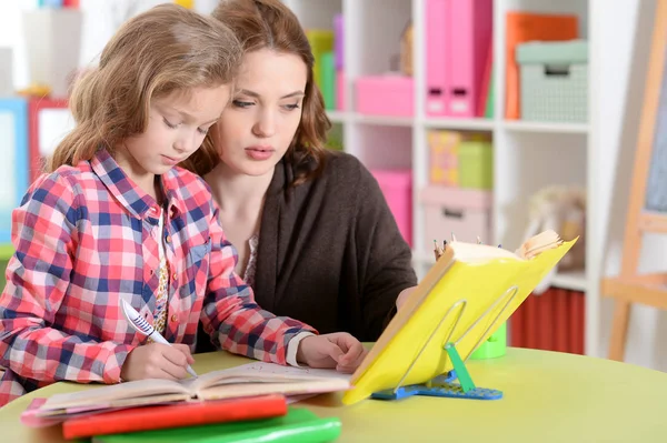 Cute little girl doing homework — Stock Photo, Image