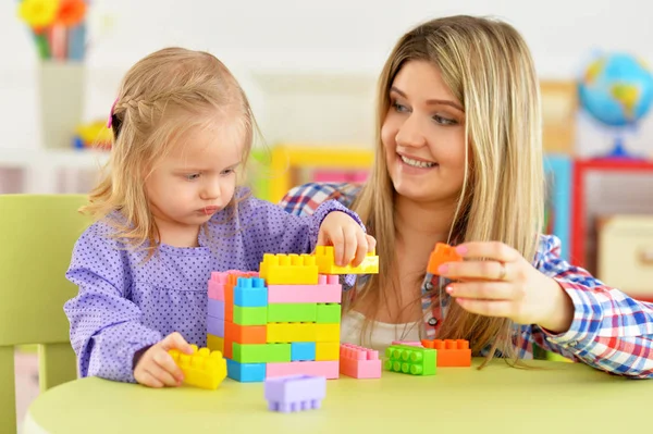 Cute Little Girl Her Mother Playing Colorful Plastic Blocks Together — Stock Photo, Image