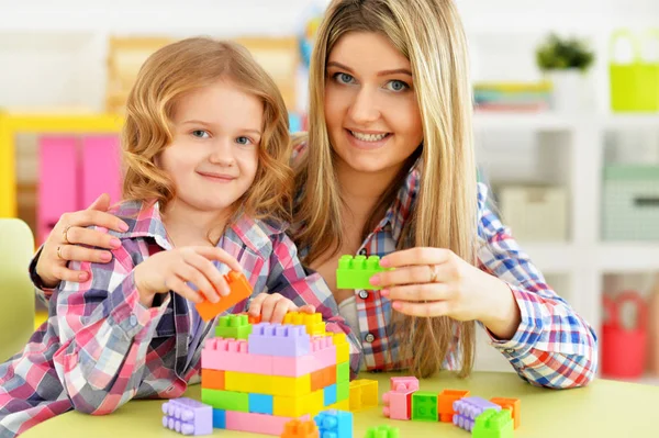 Cute Little Girl Her Mother Playing Colorful Plastic Blocks Together — Stock Photo, Image