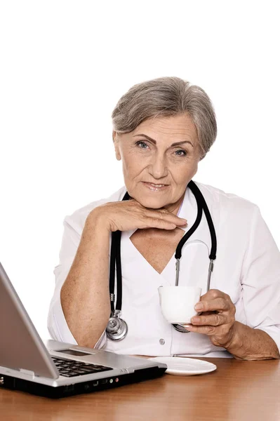 Confident Female Doctor Sitting Table Laptop Drinking Tea Isolated White — Stock Photo, Image